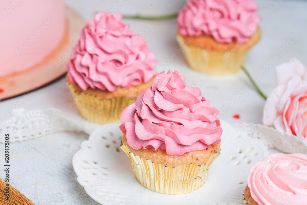 Pink cupcakes on white plate