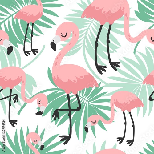 Tropical seamless pattern with pink flamingos and green palm leaves.