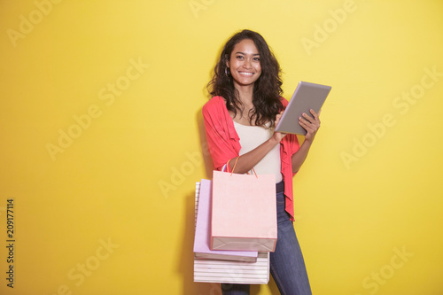 shopaholic checking stuff at online store on tablet © Odua Images