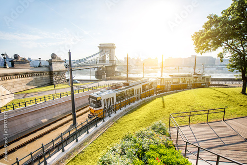 Cityscape view on the tram and famous Chain bridge on the background during the morning light in Budapest city, Hungary