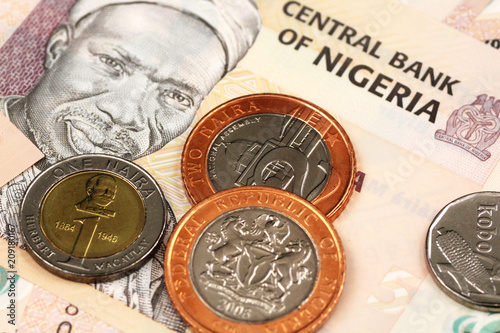 A close up image of Nigerian bank notes and coins