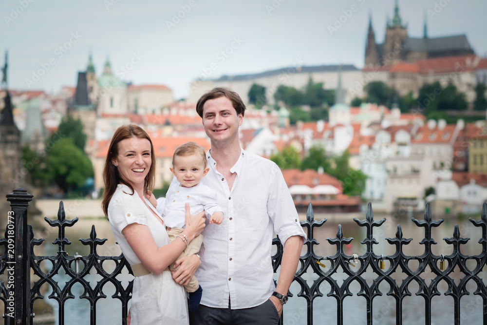 Fototapeta premium Beautiful family with little boy visiting Prague