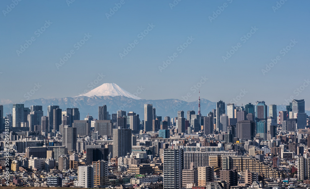 Fototapeta premium Tokyo city view , Tokyo downtown building and Tokyo tower landmark with Mountain Fuji on a clear day. Tokyo Metropolis is the capital of Japan and one of its 47 prefectures.