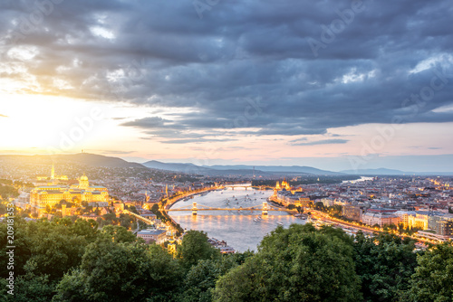 Aerial landscape view on the illuminated city during the twilight with beautiful clouds in Budapest, Hungary