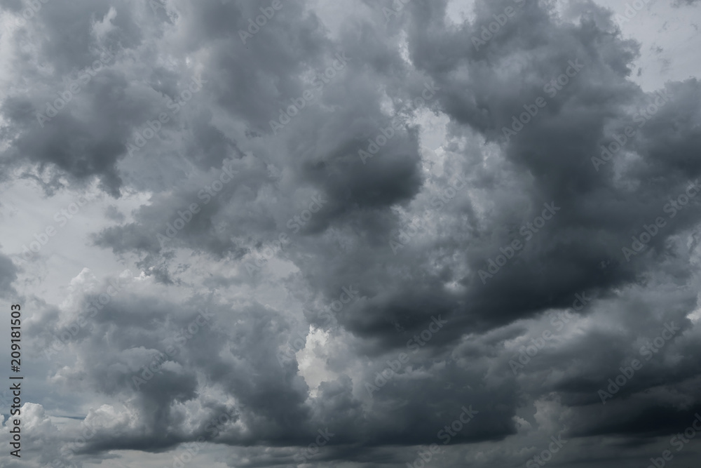 Obraz premium Dark storm clouds before rain used for climate background. Clouds become dark gray before raining. Dramatic background.