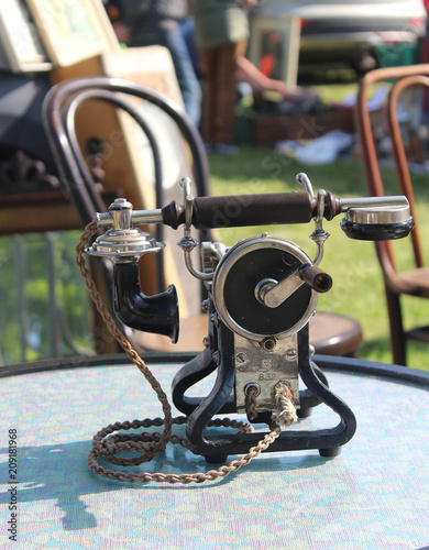 Old technology - old phone sold at antiquites and curiosities market photo