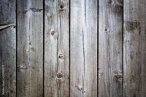 Old grunge dark brown textured wooden background, vertical boards