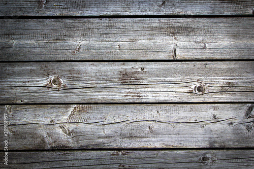 Old grunge dark brown textured wooden background, horizontal boards