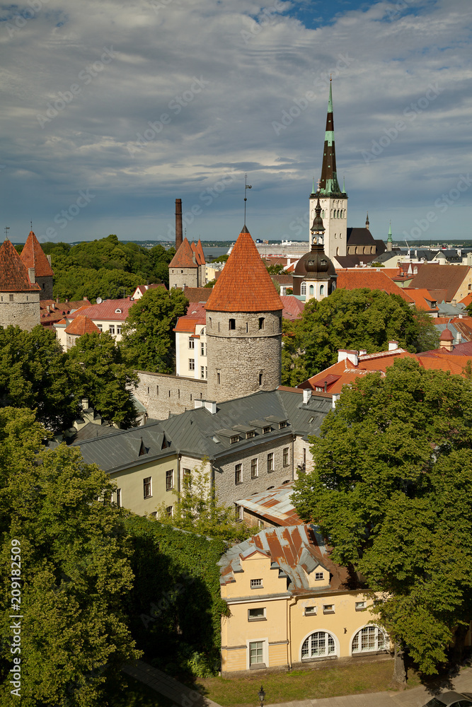 TALLINN, ESTONIA - View from Viewing Point Kohtuotsa, Toompea hill at The Old Town, St. Olaf's Church, Baltic sea and cruise ferry