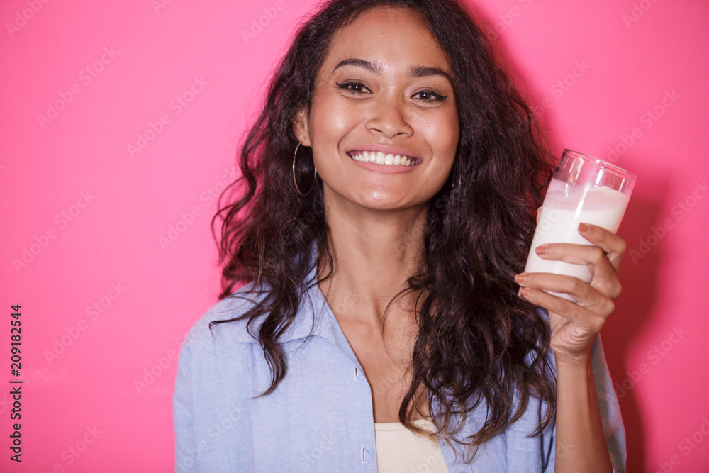 expressive face of asian woman with a glass of milk expressive face of asian woman with a glass of milk