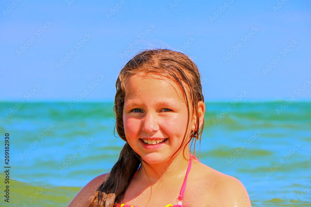 A teenage girl loves to swim in the sea. A teenage girl loves to swim in the sea.