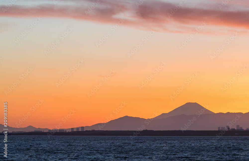 Mountain Fuji and Tokyo bay at sunset time in winter season.Tokyo Bay is a bay located in the southern Kanto region of Japan, and spans the coasts of Tokyo, Kanagawa Prefecture, and Chiba Prefecture.