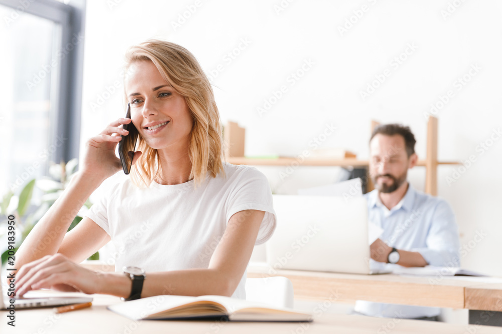 Happy woman manager working with laptop computer Happy woman manager working with laptop computer