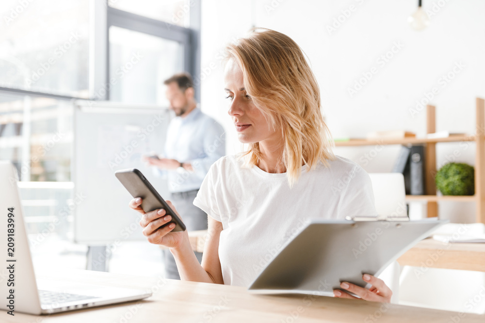 Confident woman manager working with laptop computer