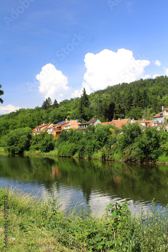 Beautiful landscape with a river and houses behind the water, central Europe