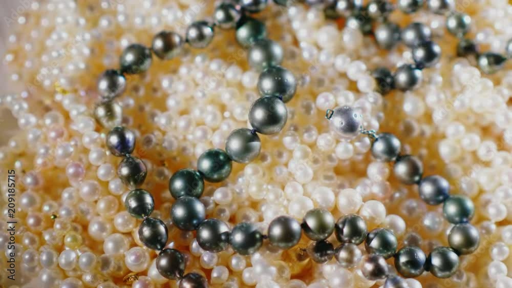 Beads from natural pearls of black and white color
