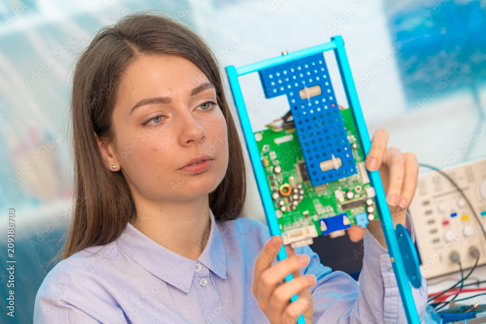 girl student in the class physics and electronics