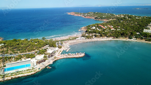 Fototapeta Naklejka Na Ścianę i Meble -  Aerial drone bird's eye photo of famous marina of Vouliagmeni with luxury yachts docked in south Athens riviera Peninsula with turquoise clear waters, Greece