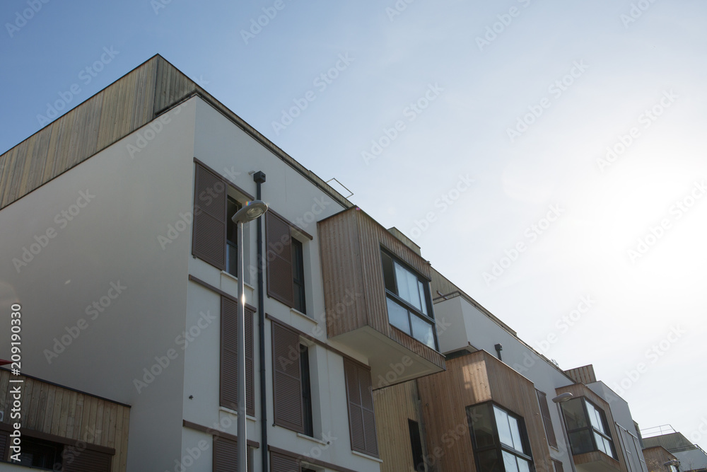 Modern apartment buildings on a sunny day with a blue sky Modern apartment buildings on a sunny day with a blue sky
