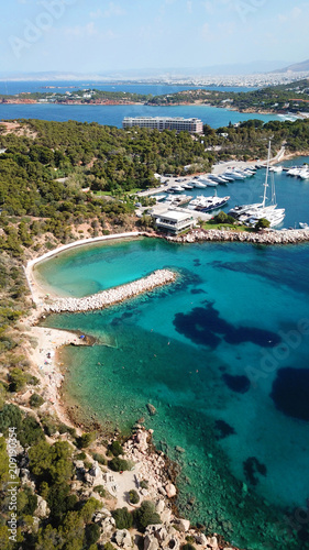 Aerial drone bird's eye photo of famous marina of Vouliagmeni with luxury yachts docked in south Athens riviera Peninsula with turquoise clear waters, Greece © aerial-drone