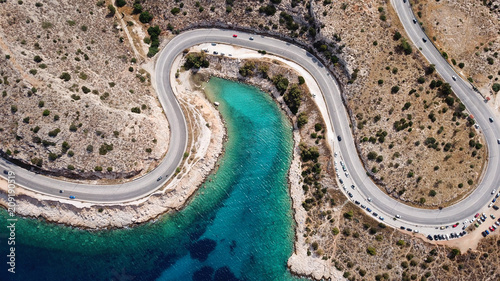 Aerial drone bird's eye view photo of road in Athens riviera seaside known limanakia forming small bays with turquoise clear waters, Vouliagmeni, Attica, Greece photo