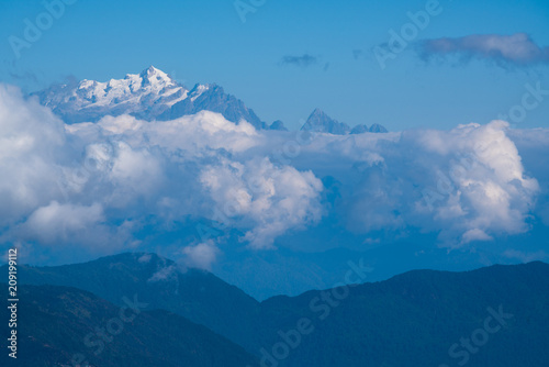 Kangchenjunga peak mount behind cloud cover landscape © happystock