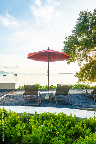 Beautiful tropical sea ocean and beach with umbrella and chair © siraphol