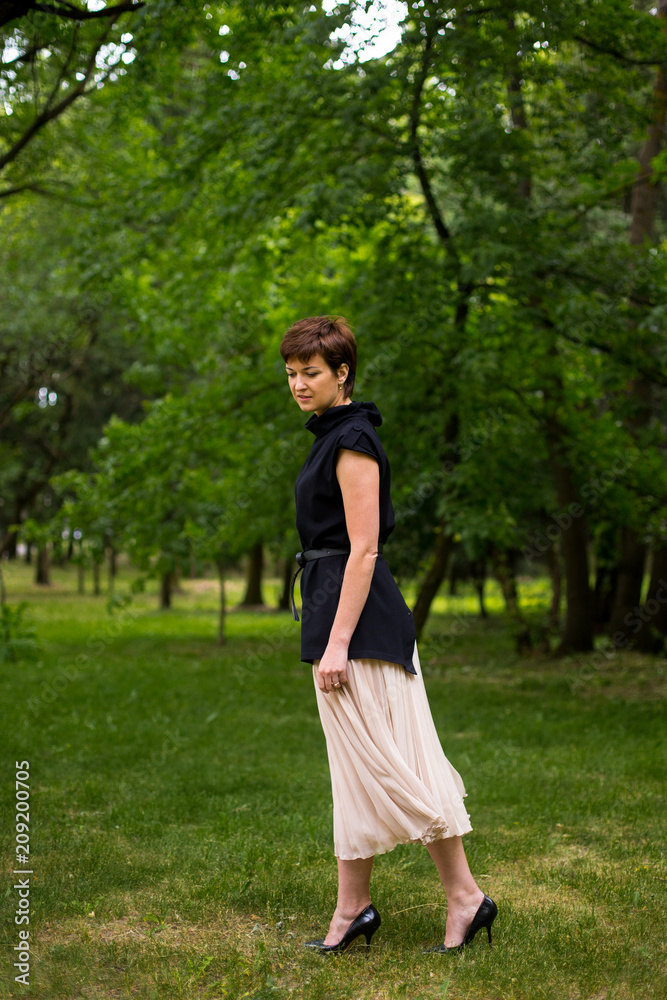 Portrait of beautiful aged woman in the park Portrait of beautiful aged woman in the park