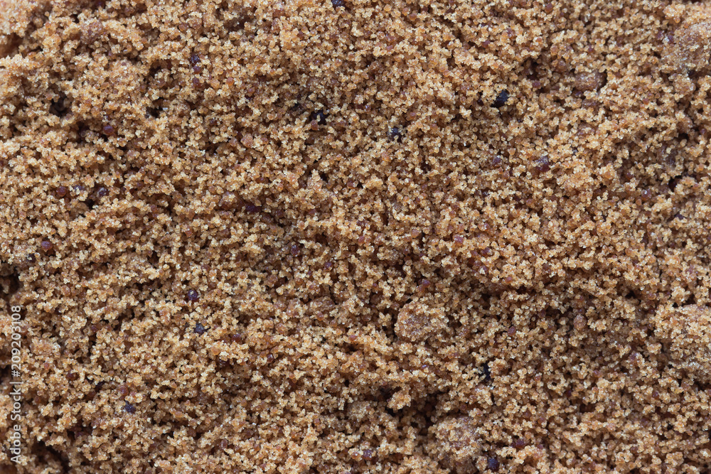 Top view flat lay of natural brown sugar or unrefined sugar with close up view and copy space to show texture. Sweet seasoning for good health. Ingredient prepared for cooking or bakery and beverage.. Top view flat lay of natural brown sugar or unrefined sugar with close up view and copy space to show texture. Sweet seasoning for good health. Ingredient prepared for cooking or bakery and beverage..