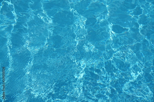 surface of blue swimming pool,background of water in swimming pool.