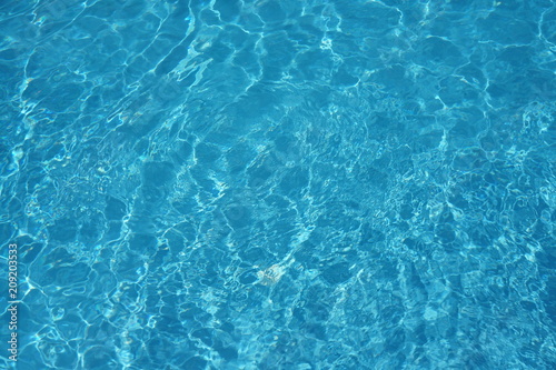 surface of blue swimming pool background of water in swimming pool.
