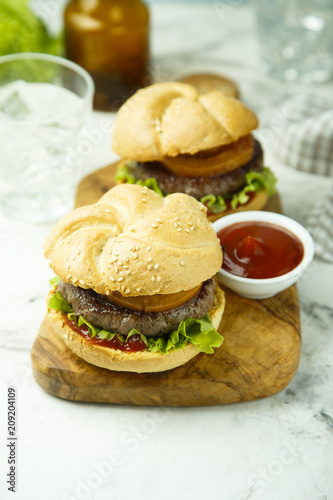 Beef burgers with tomato and lettuce