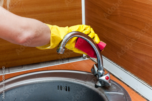 wash the sink with a dishwashing detergent