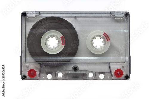 An old blank transparent audio cassette, isolated on white background (Objects, Technology).