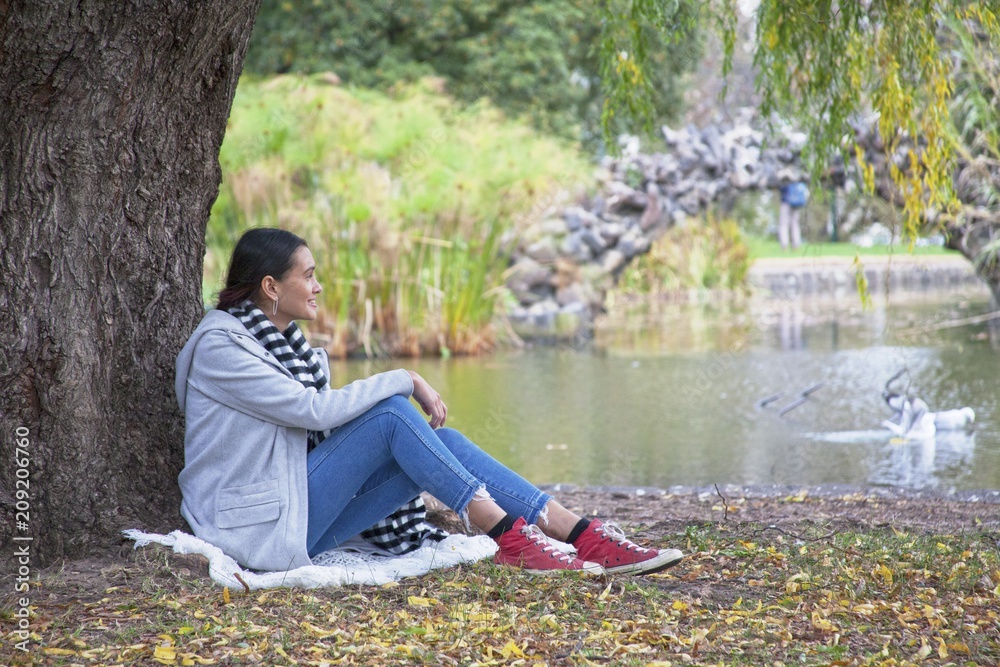 Girl sitting at a lake Girl sitting at a lake