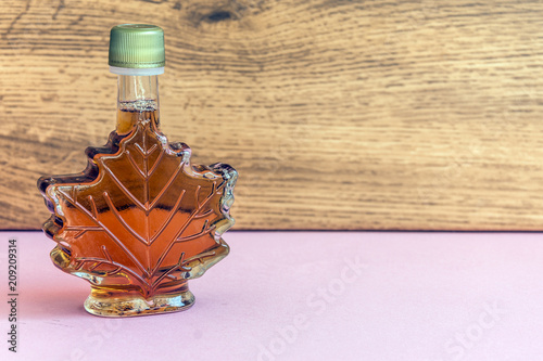Maple syrup in a bottle maple leaf shape. Suovenir from Canada.  photo