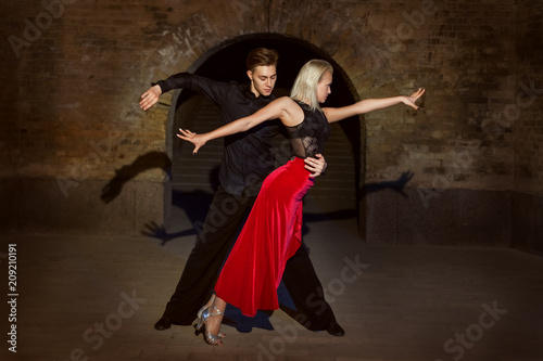 Argentine Tango in two. Passionate dance during a date with a young couple.