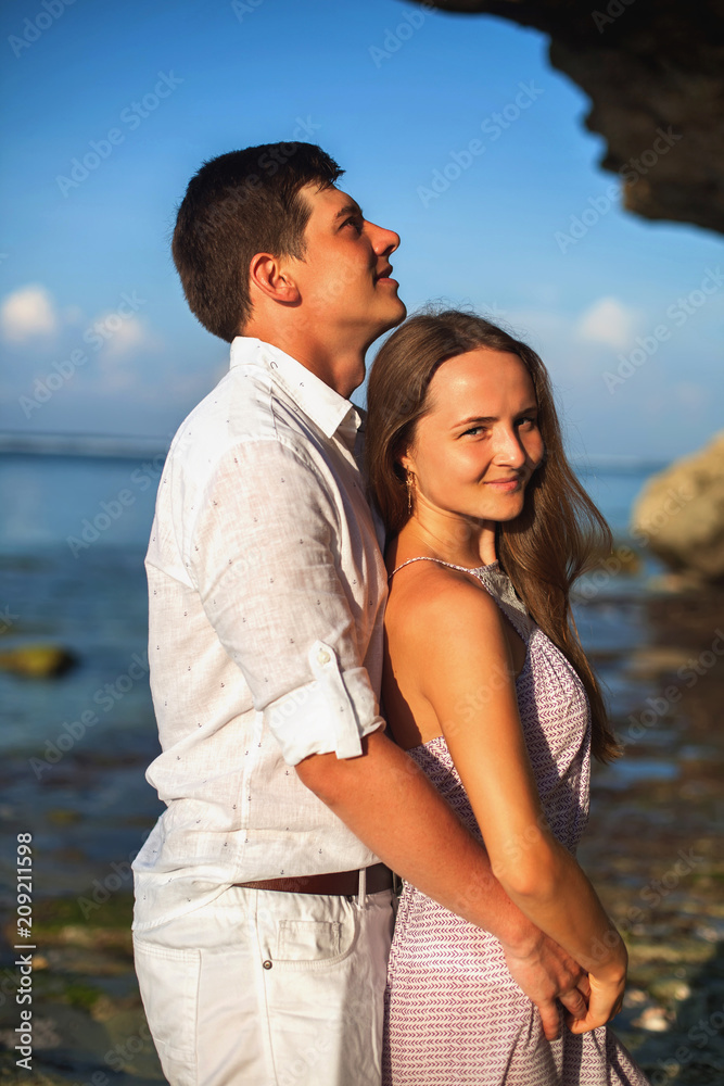 Portrait of happy couple, near the beach at background of sky. Portrait of happy couple, near the beach at background of sky.