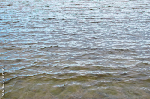 Closeup of baltic sea water surface in cold summer evening as abstract nature background.
