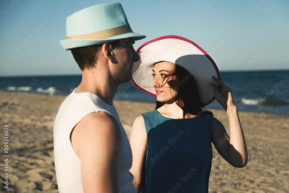  Beautiful portrait of an adult couple in love on the beach.