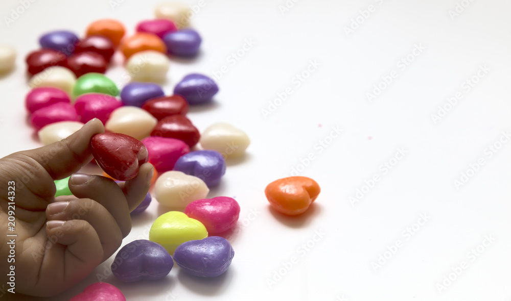 Valentines Day Concept: child holding heart .candy feast Valentines Day Concept: child holding heart .candy feast