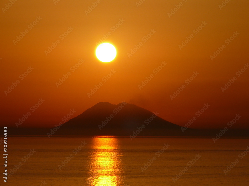 Sunset over the Stromboli, Volcano Stromboli in the evening time