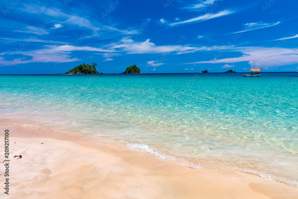 Beautiful tropical beach with crystal clear ocean and islands (Nacpan Beach)