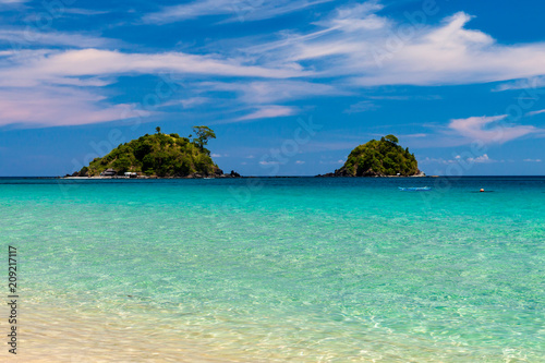 Beautiful tropical beach with crystal clear ocean and islands  Nacpan Beach 