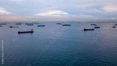 Photography Aerial view of container ships in the Singapore Strait at dusk