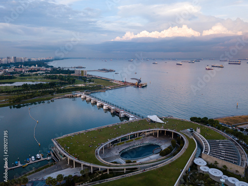 Bilde på lerret Aerial drone view of Singapore Marina Barrage with ships waiting out to sea