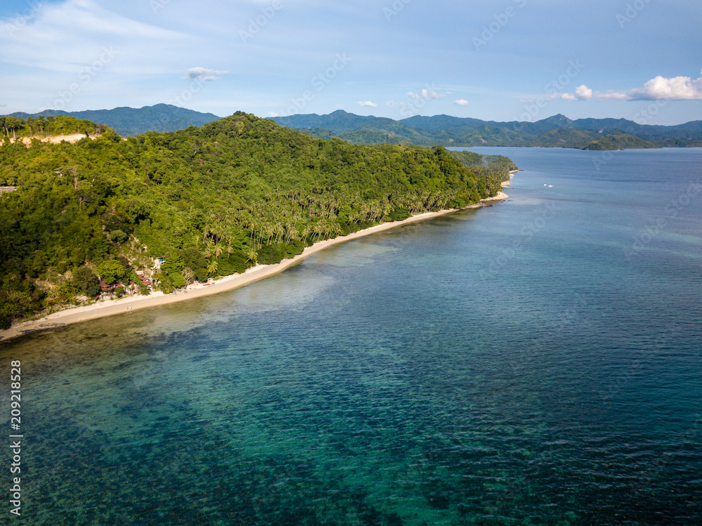 Aerial drone view of a beautiful tropical landscape with towering limestone islands in the ocean