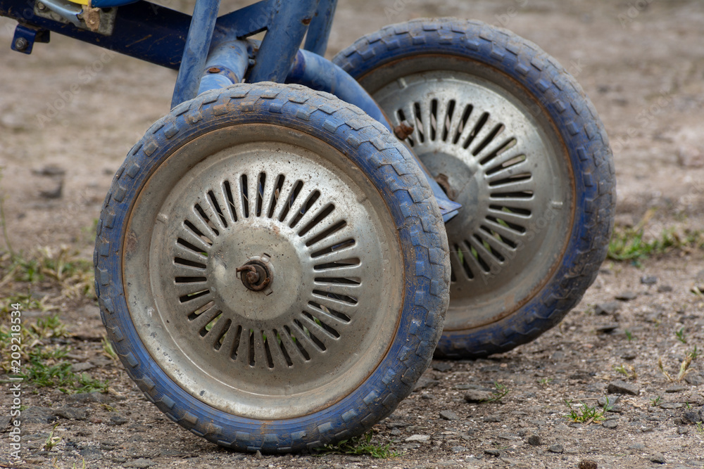 Wheels of a children's bicycle, close-up Wheels of a children's bicycle, close-up