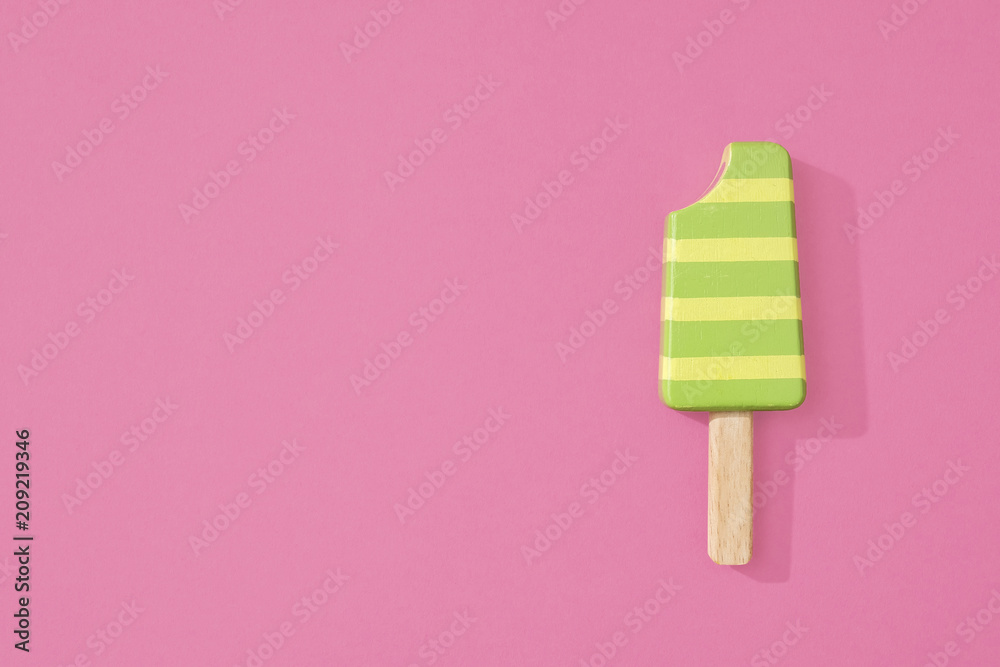 Ice cream popsicles lollipops on pastel pink background for summer