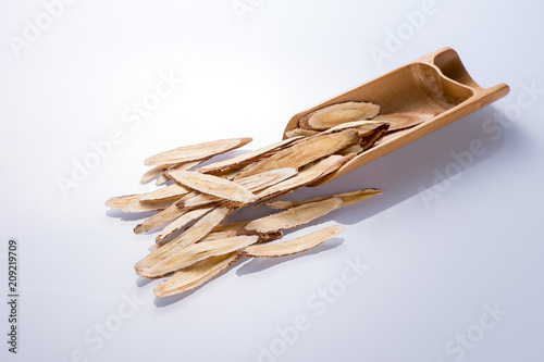 Chinese herbal medicines -- Astragalus on white background, blank for text copy space,